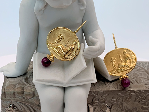 Tagliamonte 18K earrings with large Ruby beads and image of Venus and Cupid